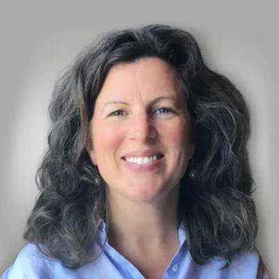 A headshot of Tina Brewer, a Registered Nurse at Symmetria Integrative Medical.